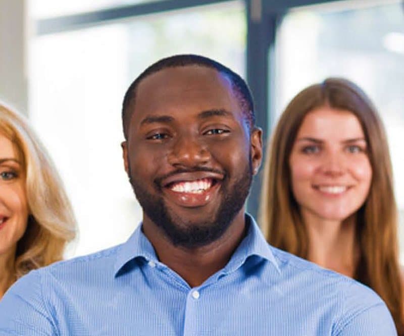 A smiling team of professionals